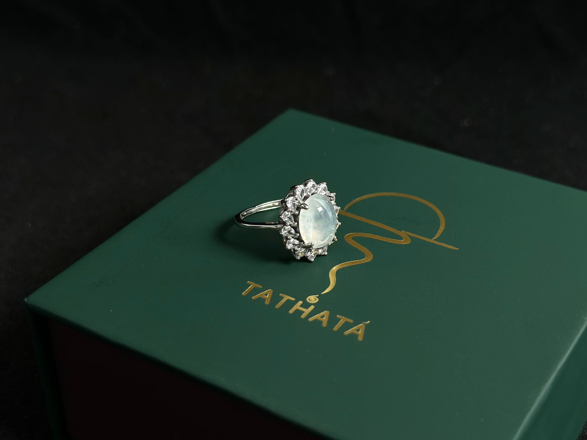 An icy jadeite bead is securely set in this ring using channel setting technique.