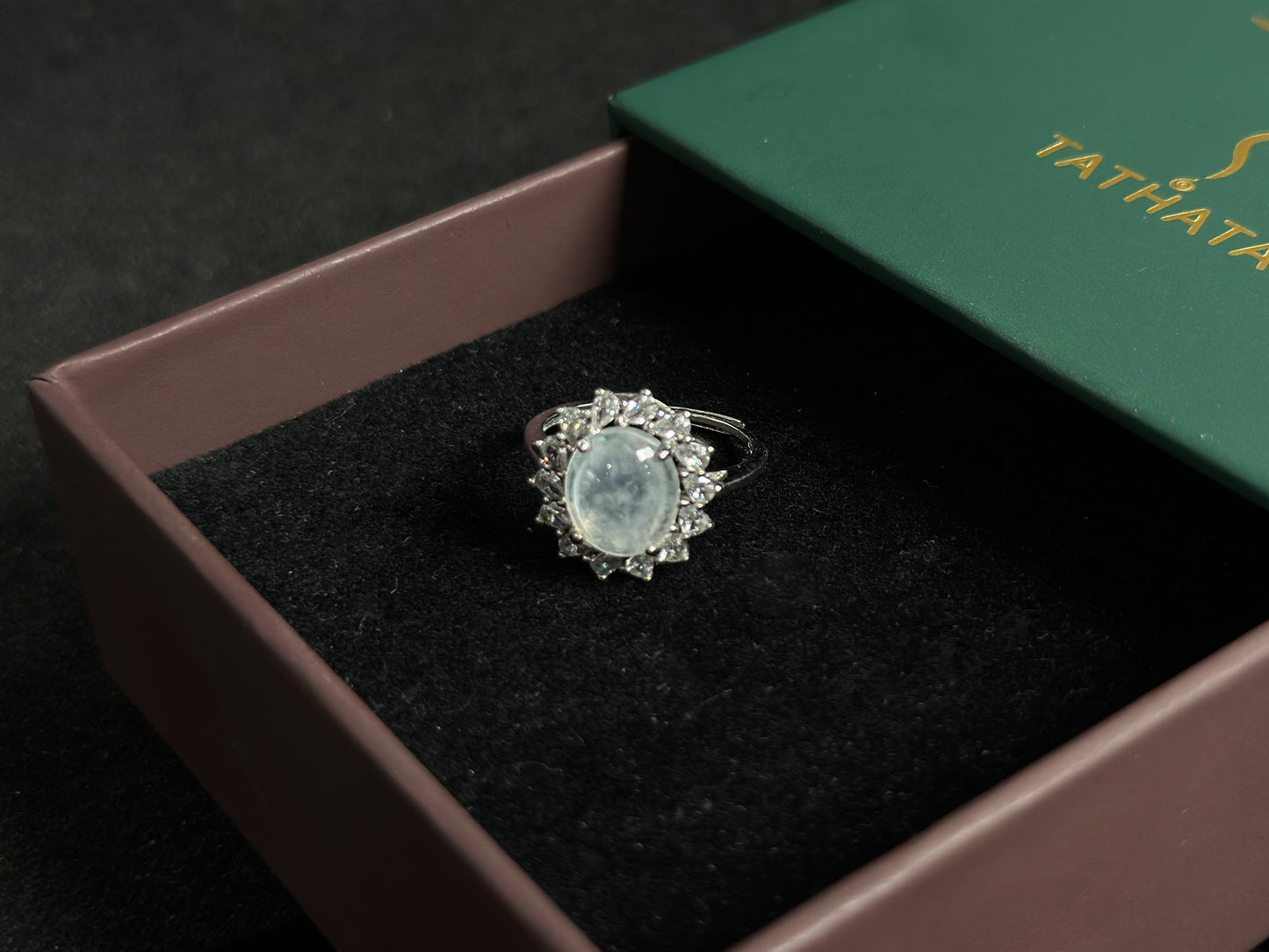 An icy jadeite bead is securely set in this ring using channel setting technique.