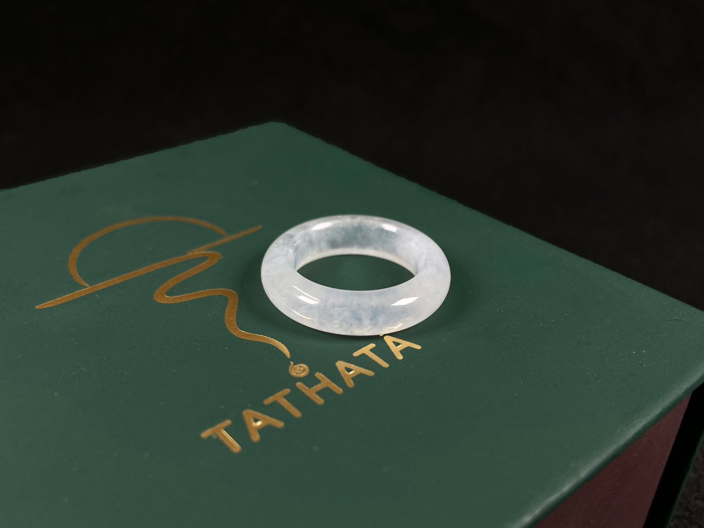 An icy-colored jadeite ring.