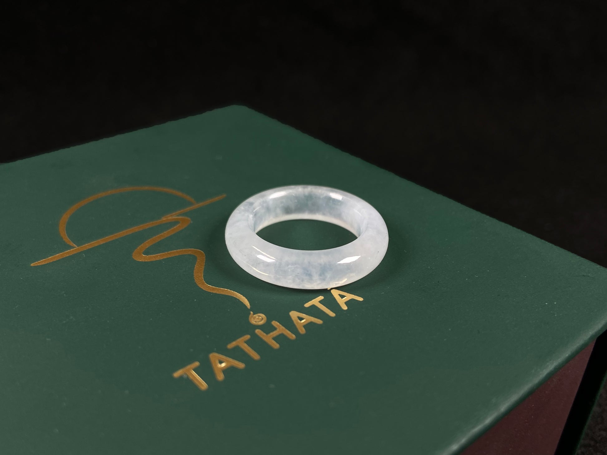 An icy-colored jadeite ring.