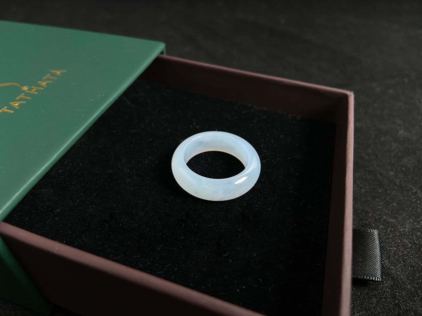 This jade ring features exceptional transparency with high quality water like clarity.