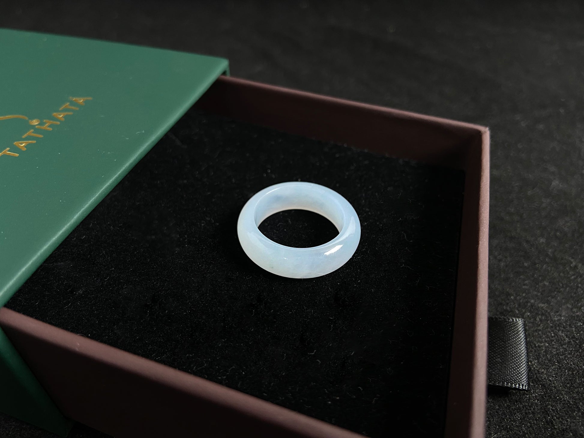 This jade ring features exceptional transparency with high quality water like clarity.