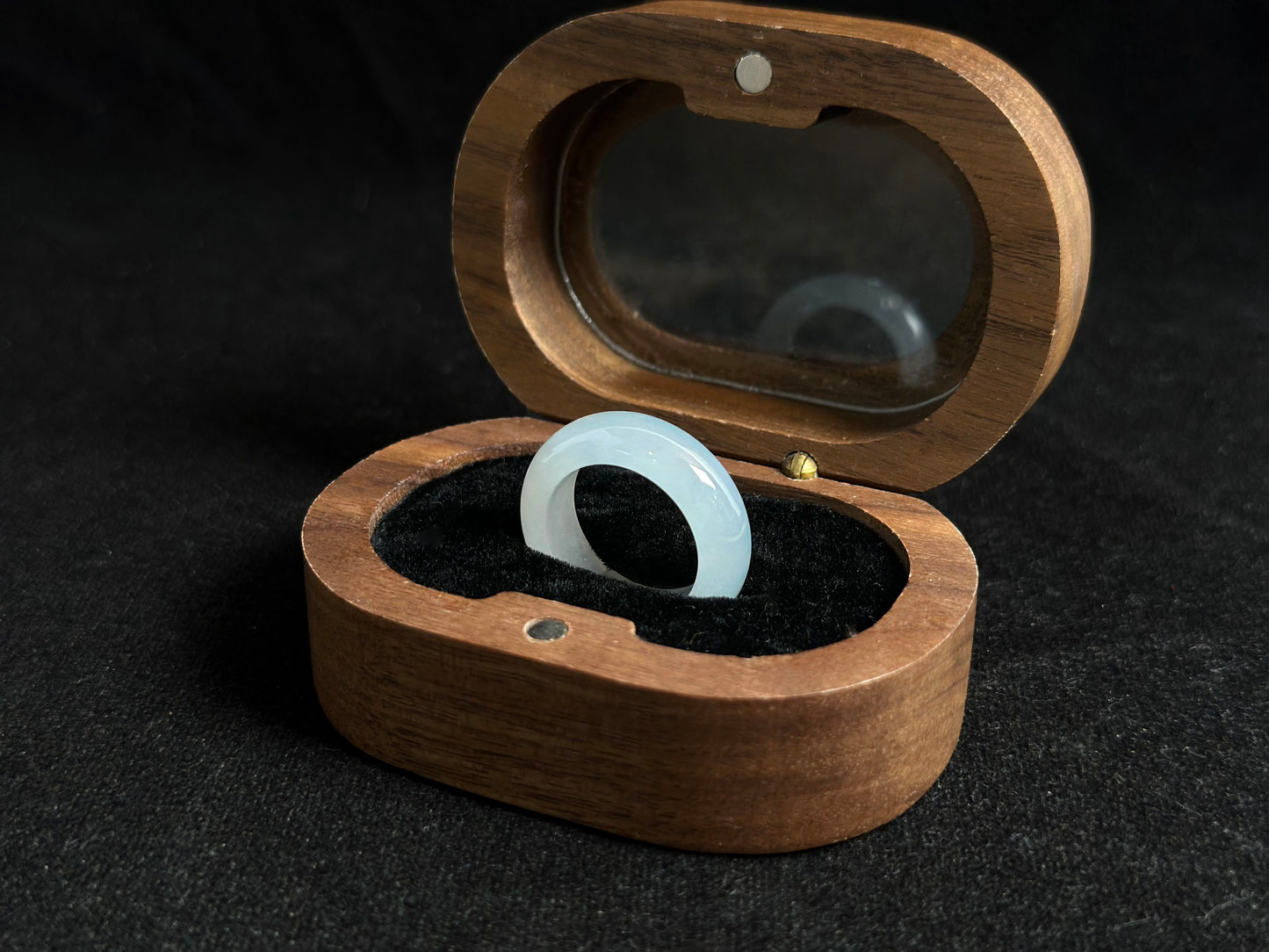 This elegant ring features a white icy jadeite with crystal clear transparency and frost like luminosity.