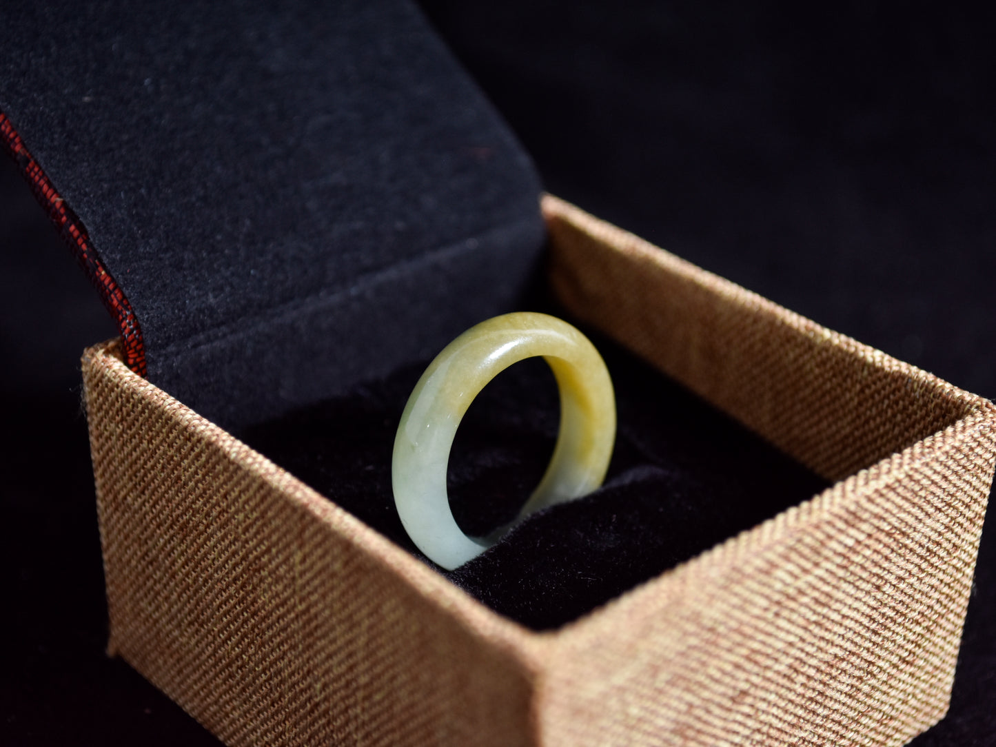 Icy white and gold jade harmoniously blended with green inclusions.