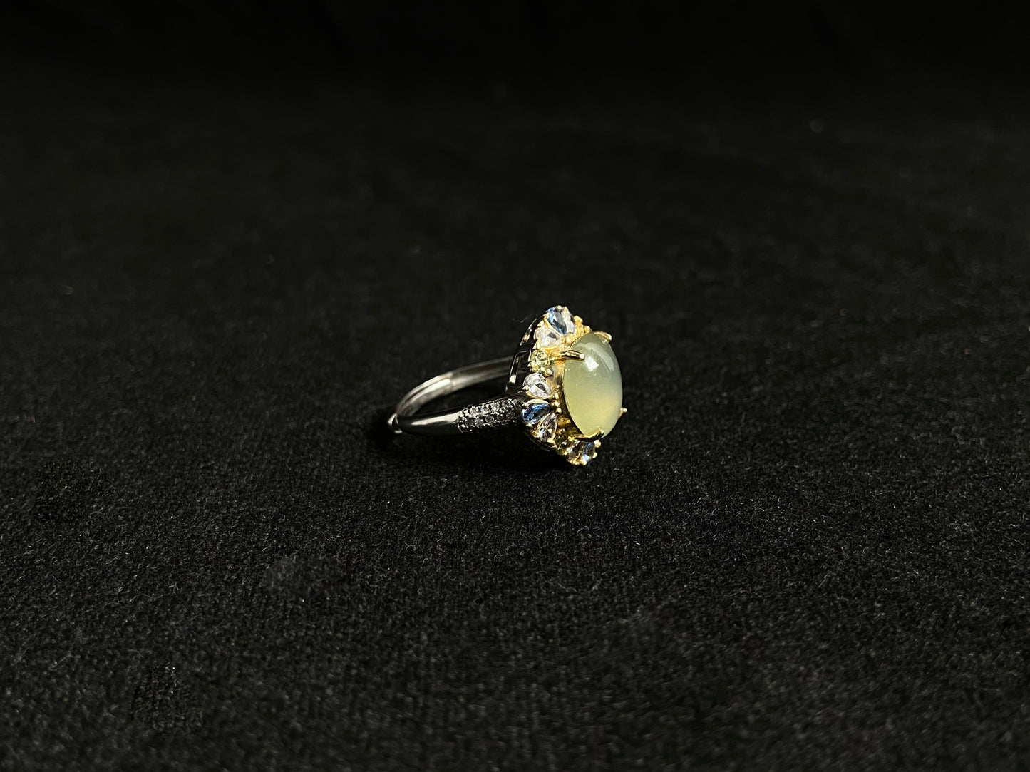 A pale yellow jadeite with icy transparency is elegantly set in this ring using prong setting technique.