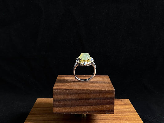 A pale yellow jadeite with icy transparency is elegantly set in this ring using prong setting technique.