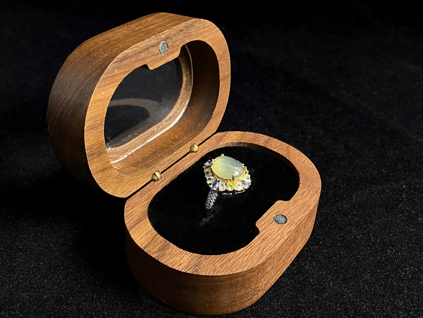 A pale yellow jadeite with icy transparency is elegantly set in this ring using prong setting technique.