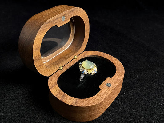 A pale yellow jadeite with icy transparency is elegantly set in this ring using prong setting technique.