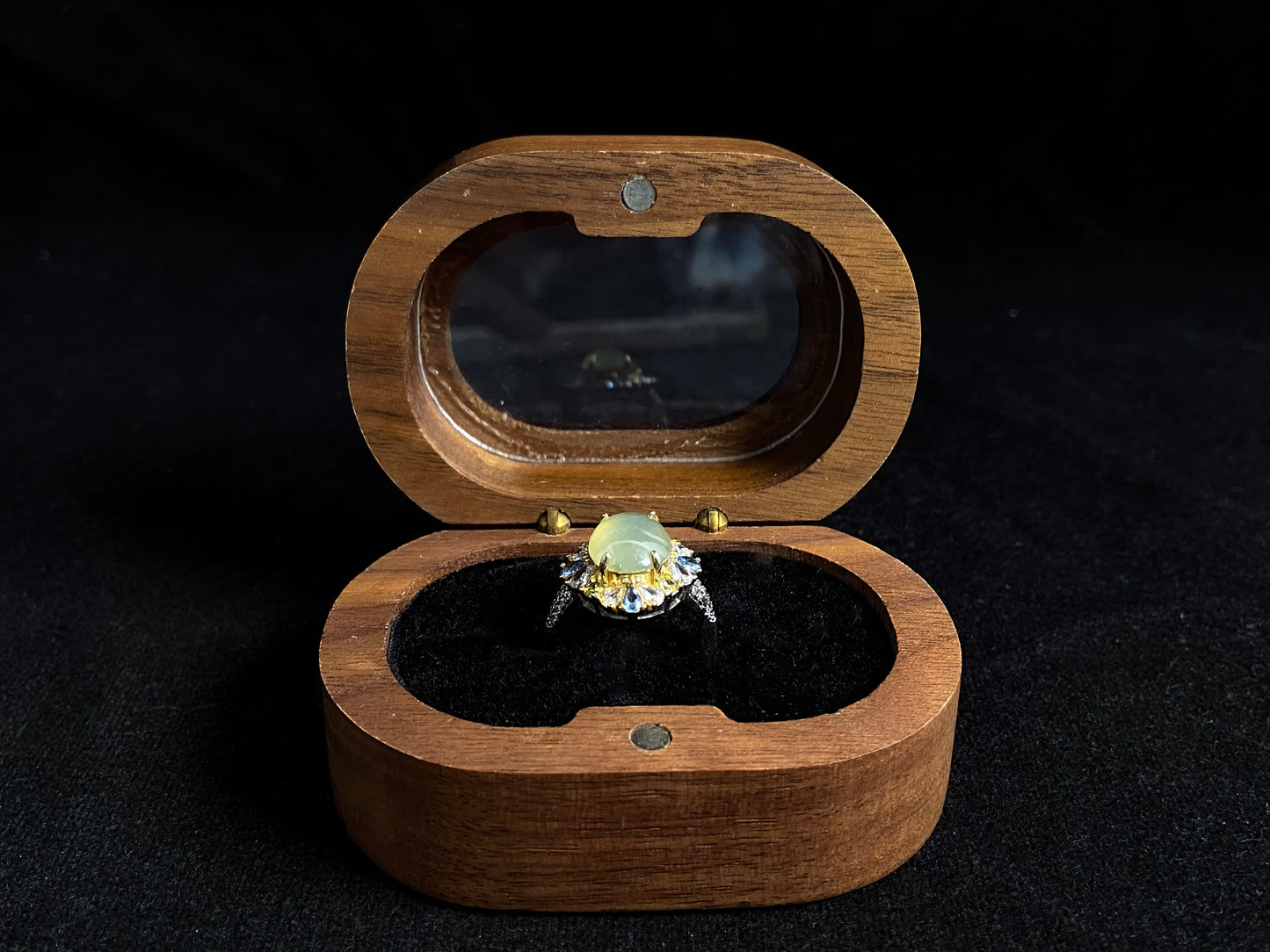 A pale yellow jadeite with icy transparency is elegantly set in this ring using prong setting technique.