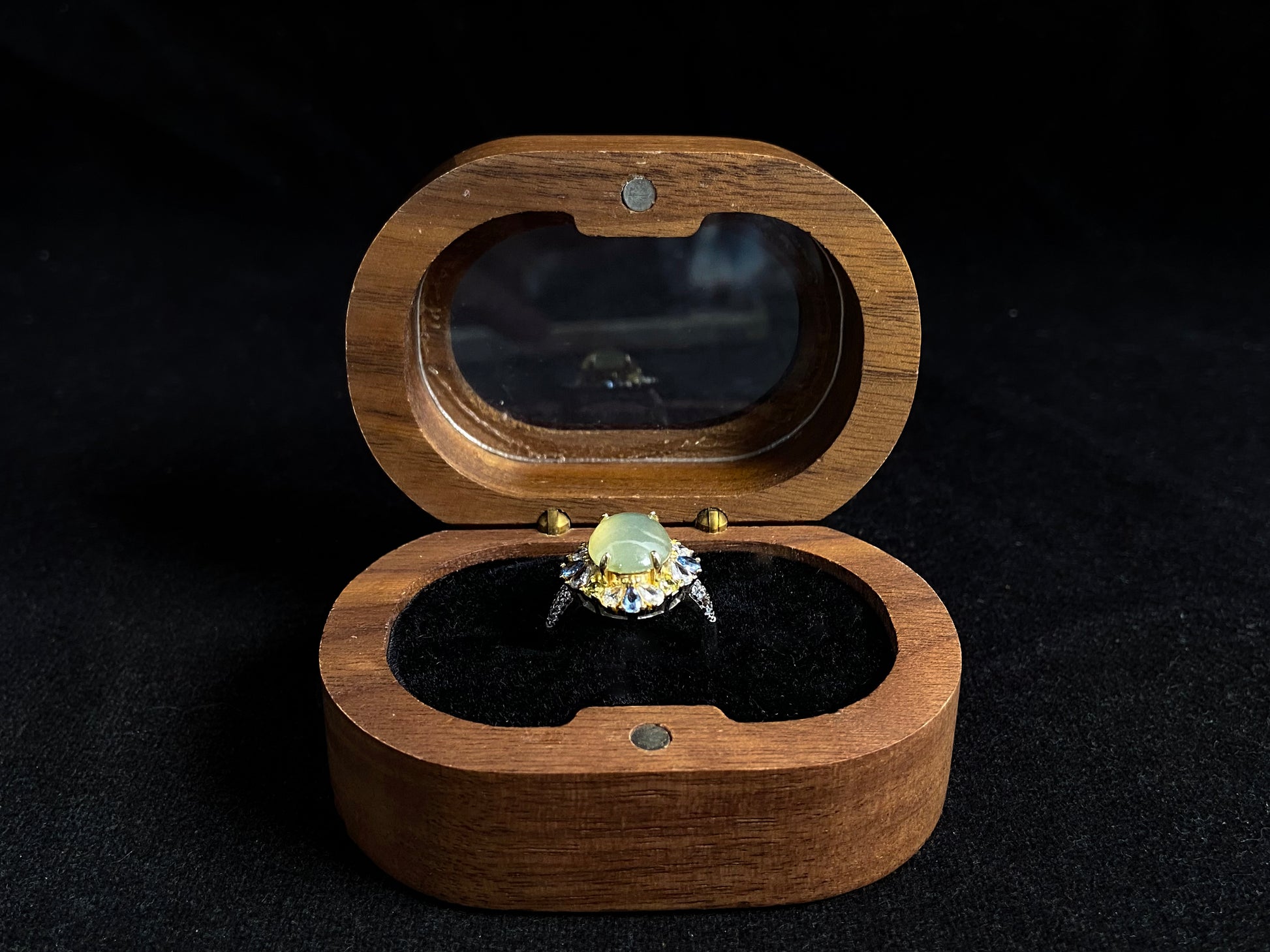 A pale yellow jadeite with icy transparency is elegantly set in this ring using prong setting technique.