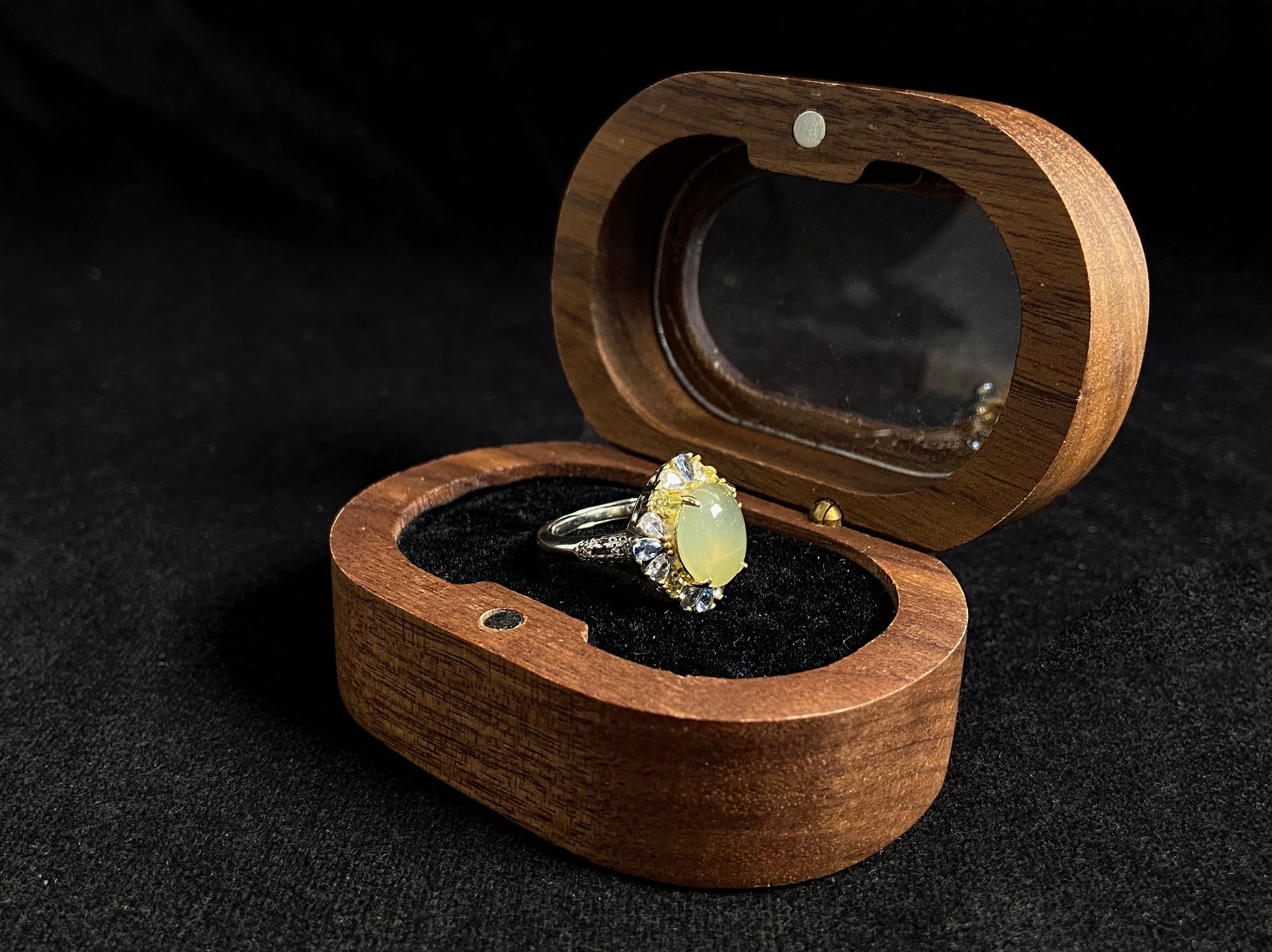 A pale yellow jadeite with icy transparency is elegantly set in this ring using prong setting technique.