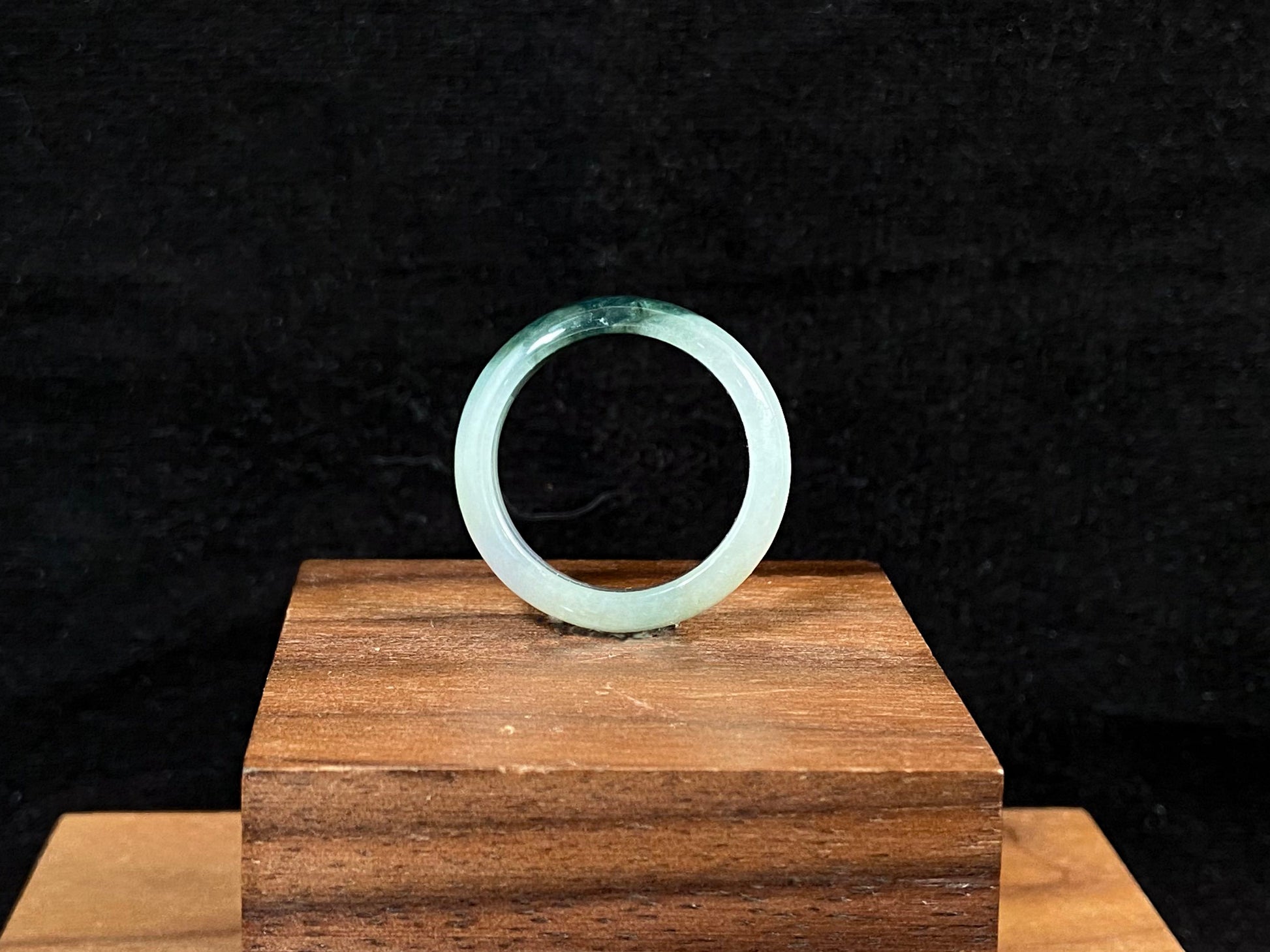 This elegant ring combines milky white jade with rich green accents.