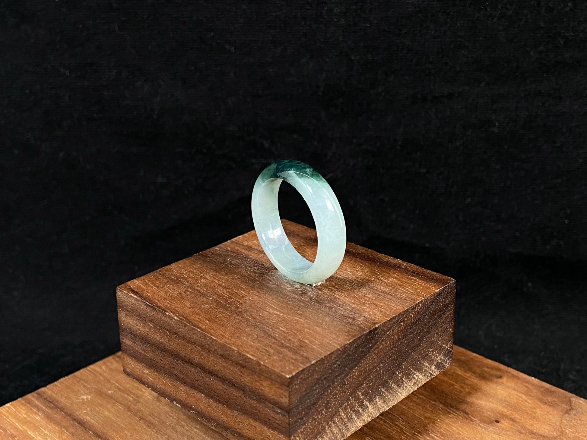 This elegant ring combines milky white jade with rich green accents.