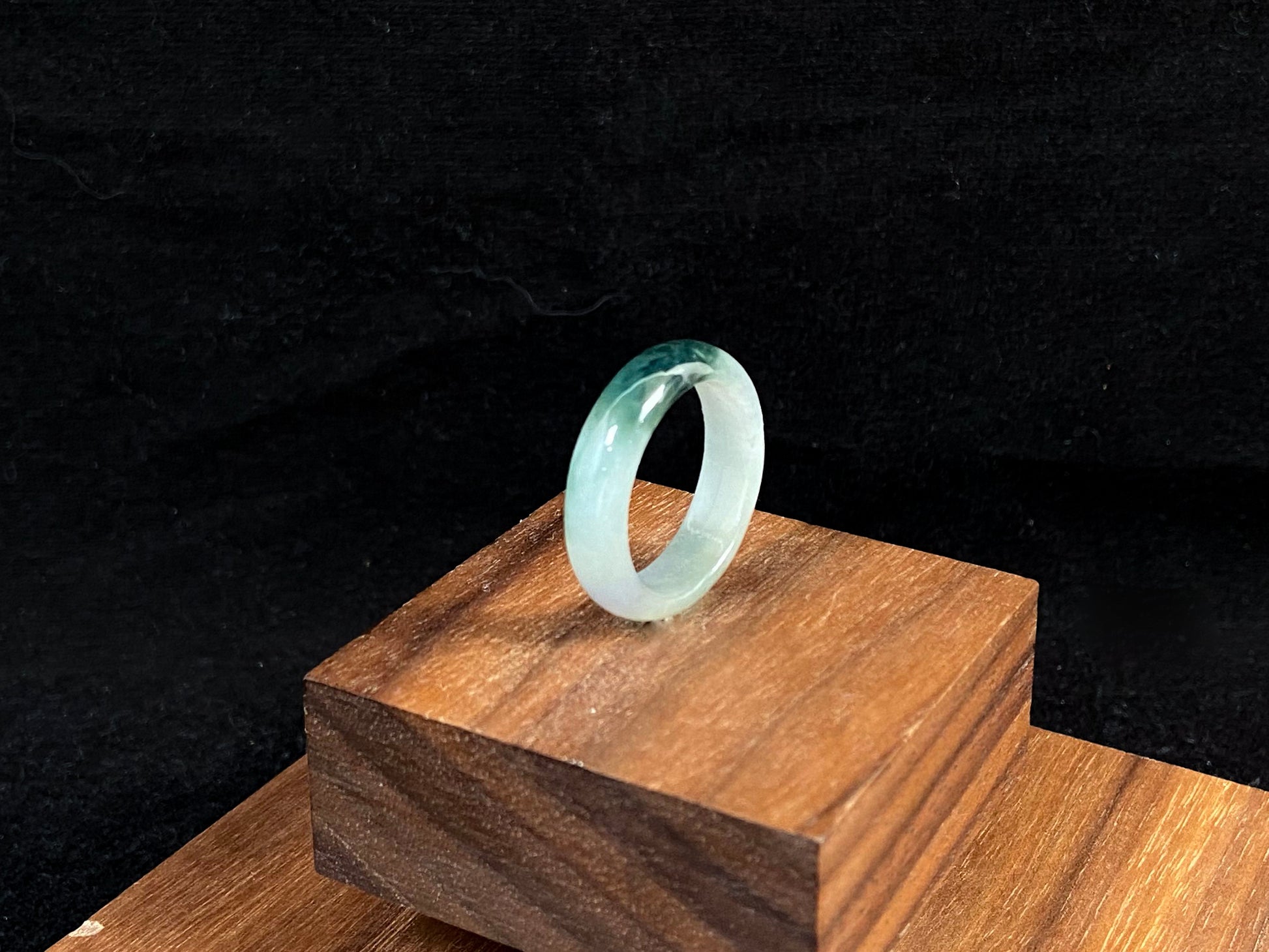 This elegant ring combines milky white jade with rich green accents.