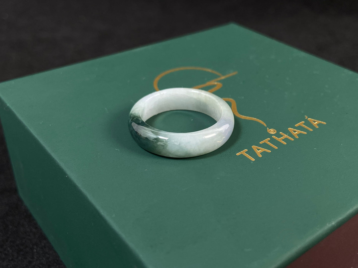 This elegant ring combines milky white jade with rich green accents.