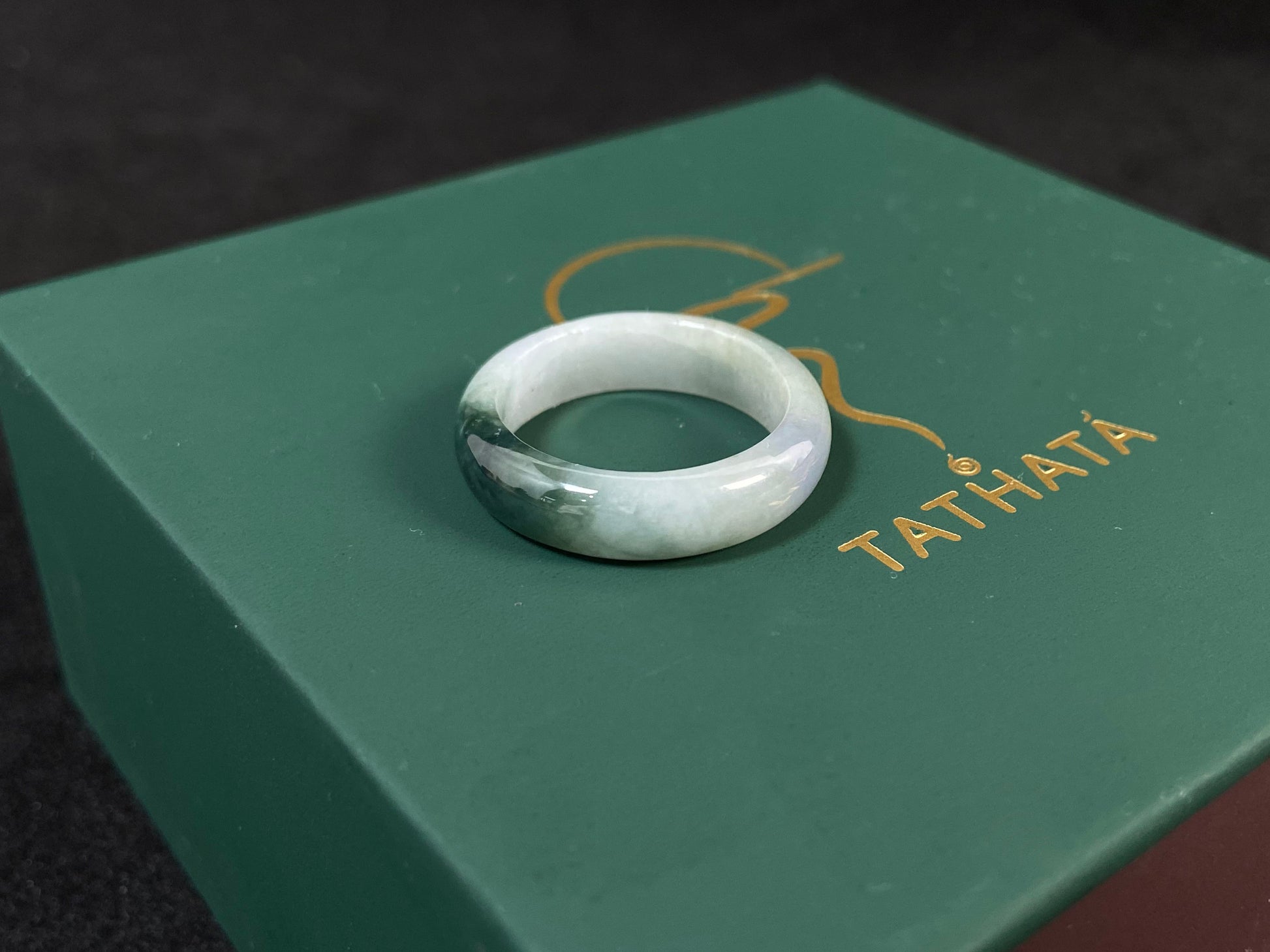 This elegant ring combines milky white jade with rich green accents.