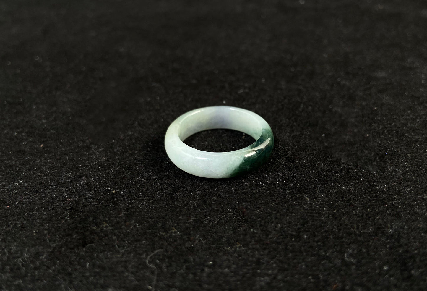 This elegant ring combines milky white jade with rich green accents.