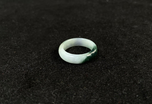 This elegant ring combines milky white jade with rich green accents.