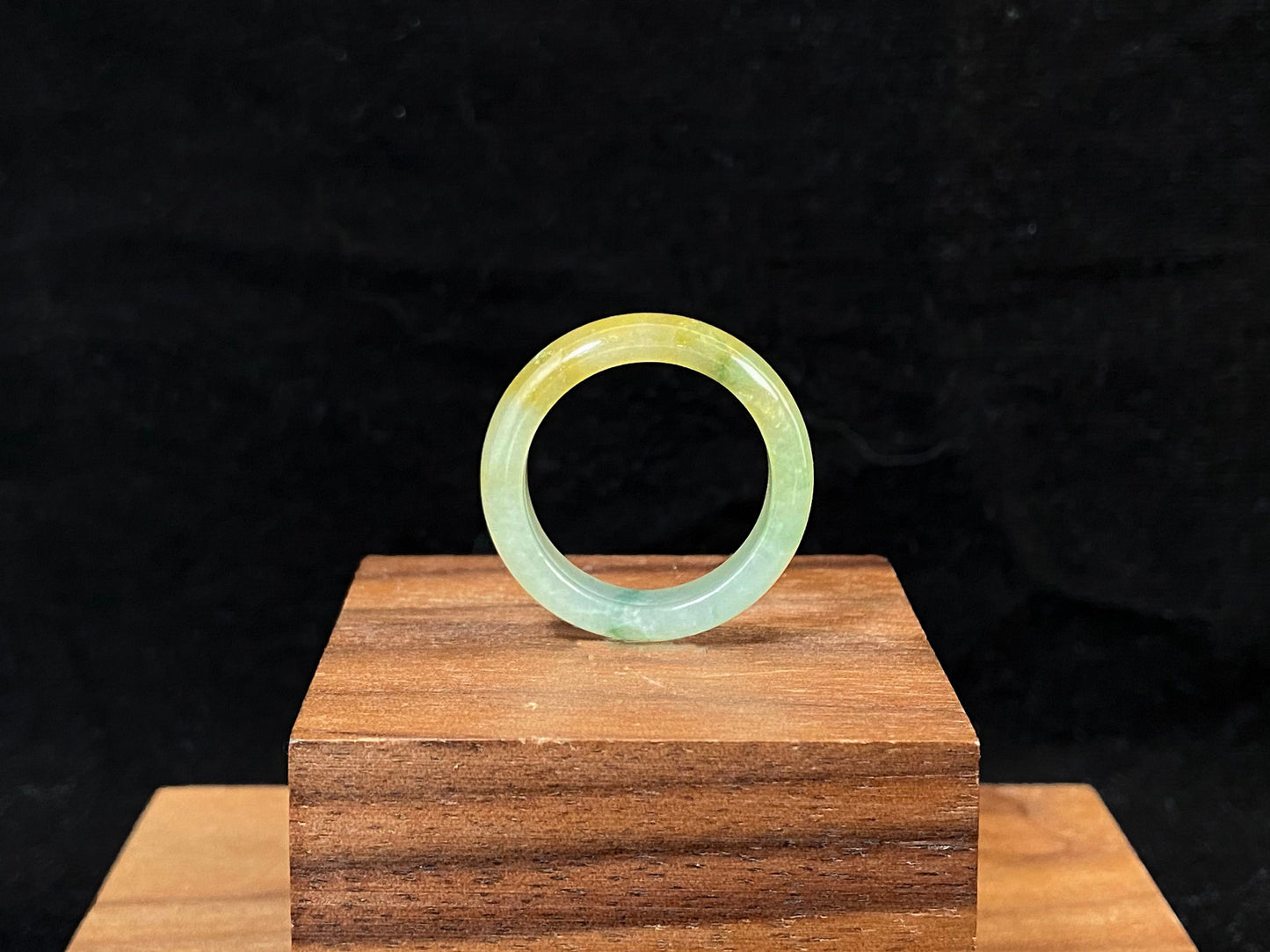 Icy white and gold jade harmoniously blended with green inclusions.