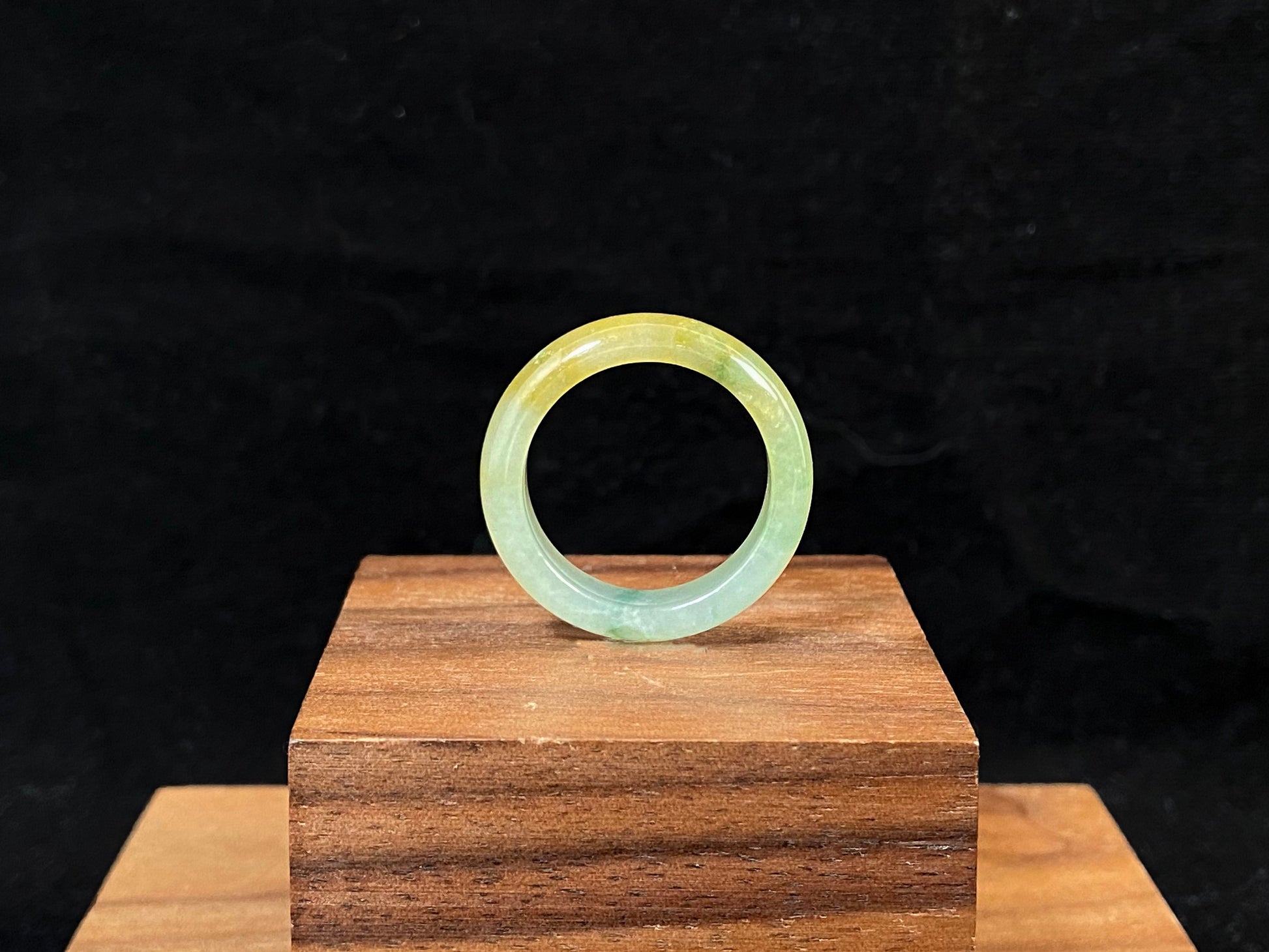 Icy white and gold jade harmoniously blended with green inclusions.