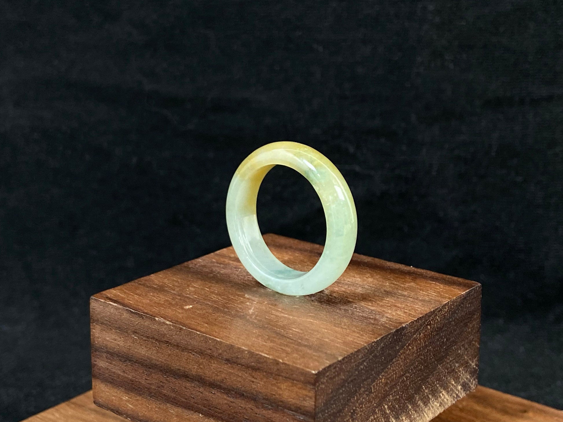 Icy white and gold jade harmoniously blended with green inclusions.