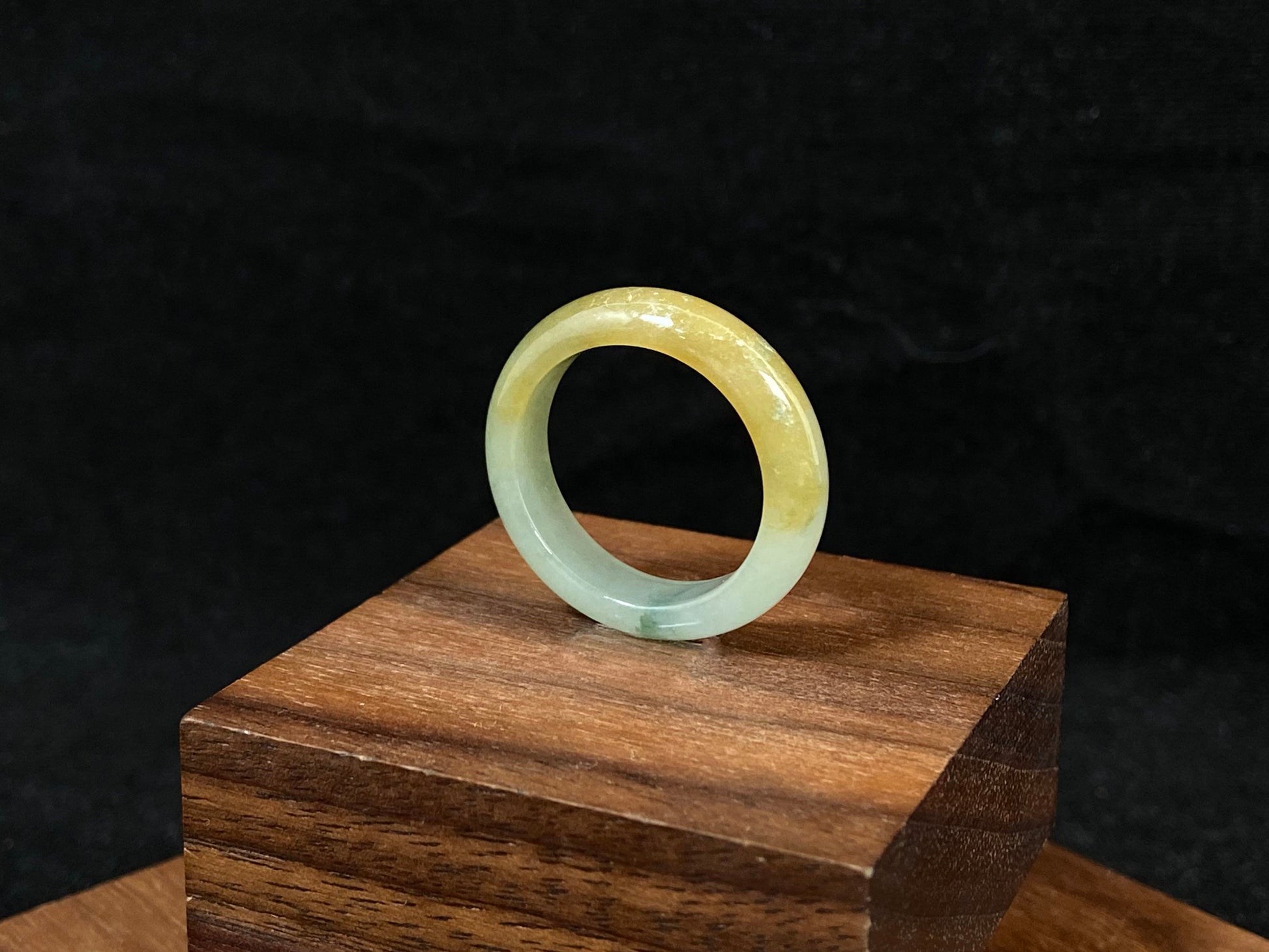 Icy white and gold jade harmoniously blended with green inclusions.