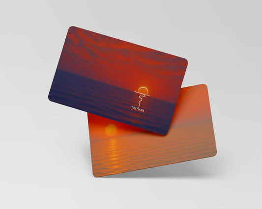 Two cards with a sunset design and 'Tathata' branding on a light gray background